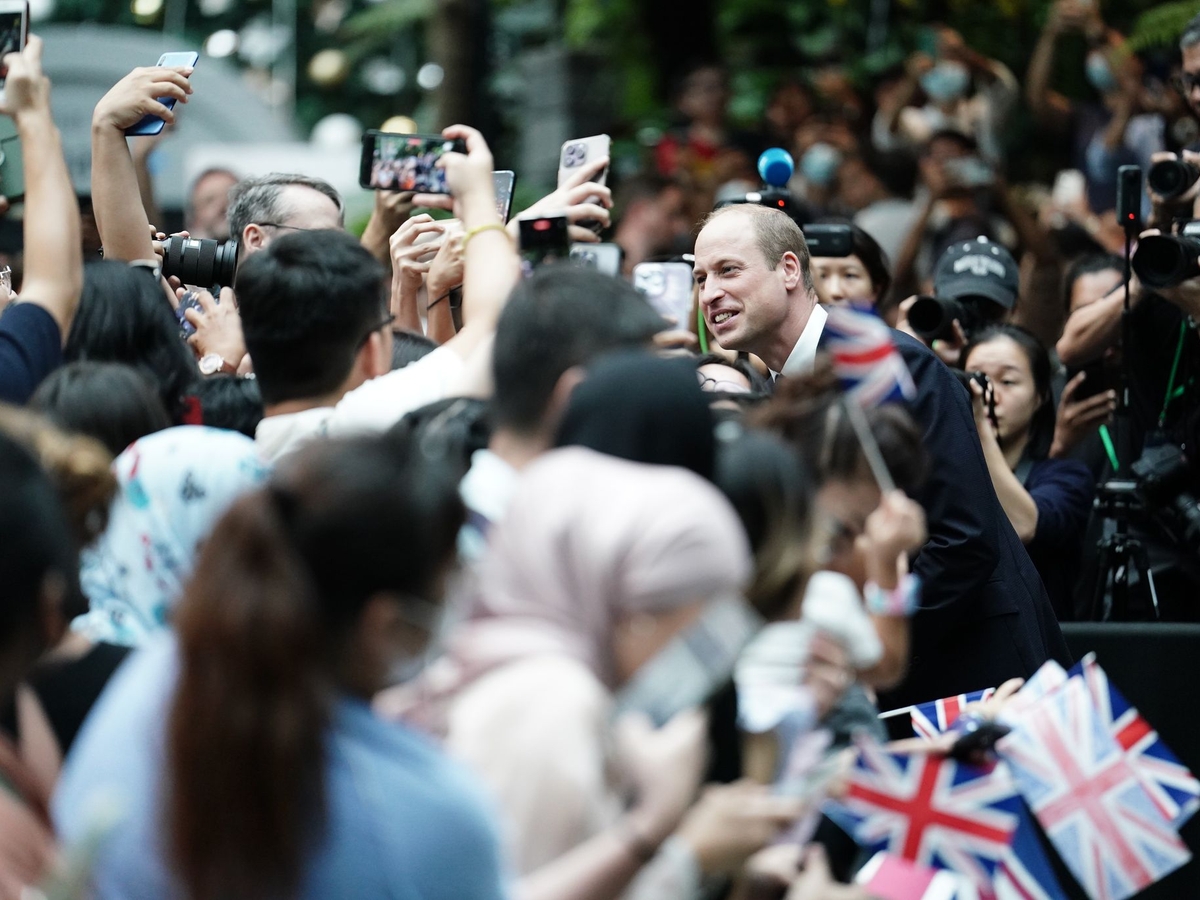 Prince William is greeted with cheers on his arrival in Singapore.