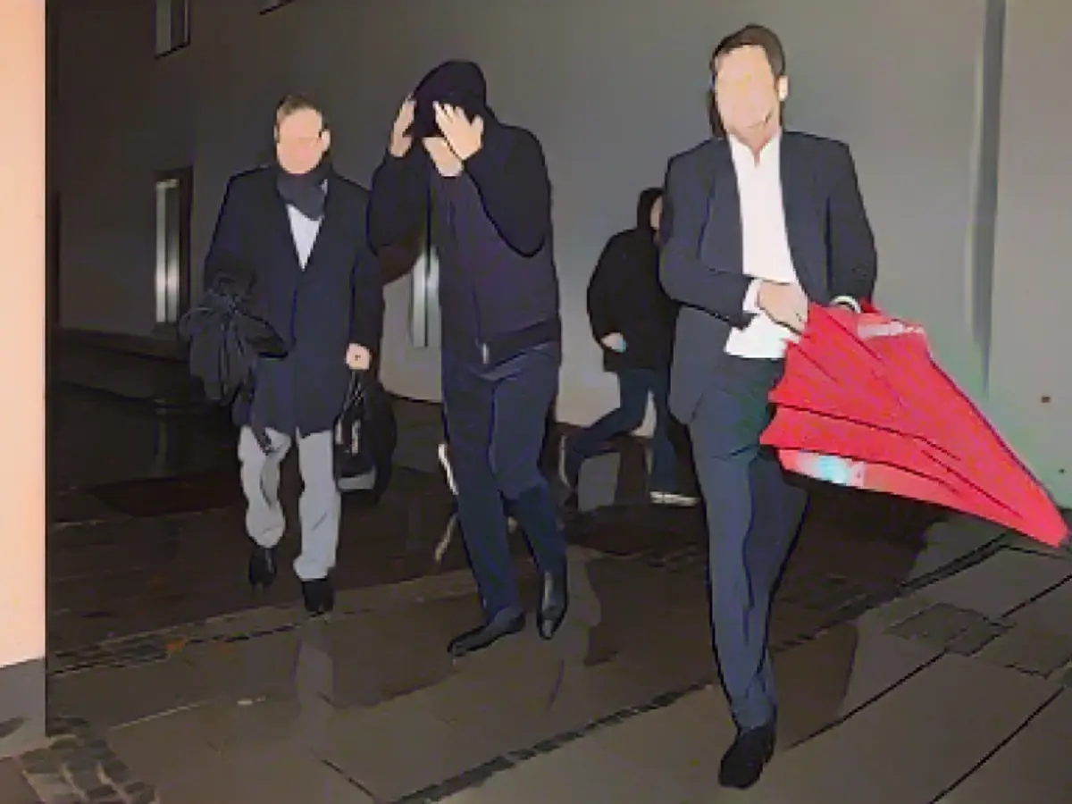 Coach Tuchel making his entrance, flanked by Prof. Dr. Dieter Mayer and Dr. Gernot Döllner