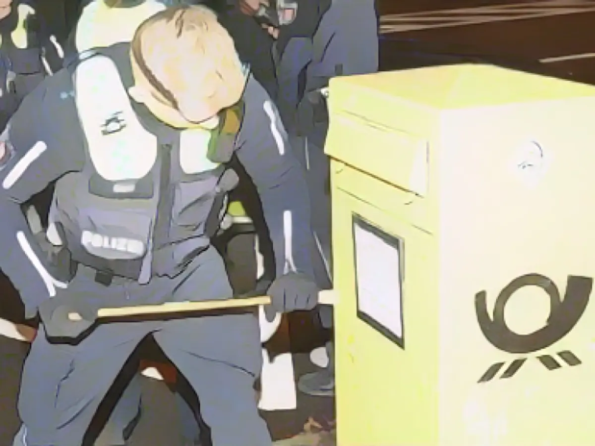 Location: Mailbox. An officer opens the yellow box and discovers the revolver inside Location: Mailbox. An officer opens the yellow box and discovers the revolver inside