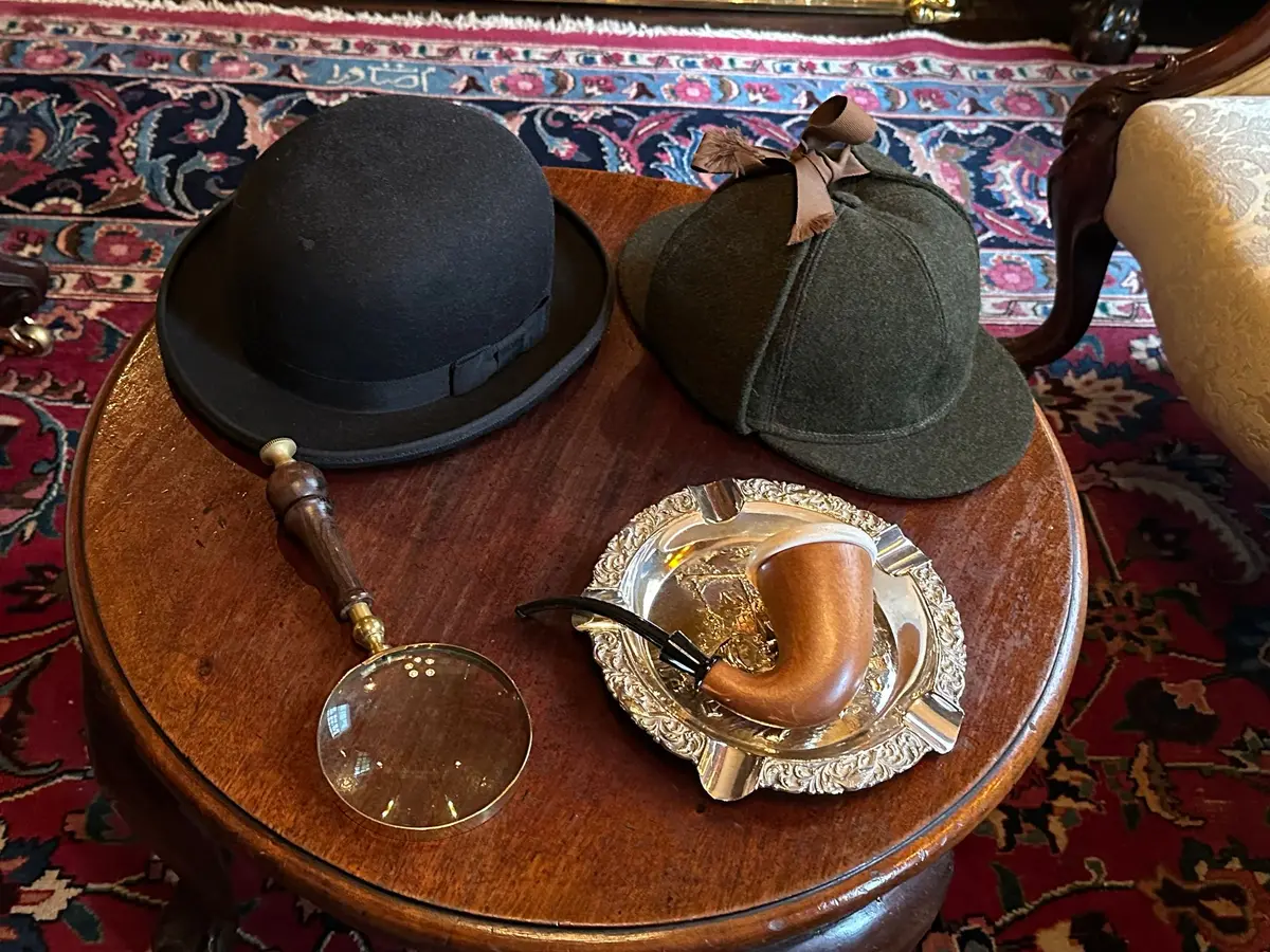 He'll be back any minute: hats, magnifying glass and pipe in the Sherlock Holmes Museum.