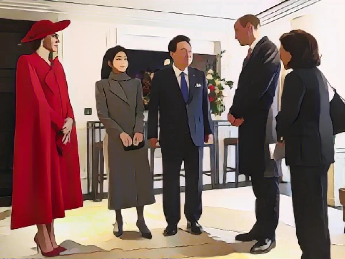 Kate and her husband, Prince William, gracefully interact with the state visitor in a London hotel