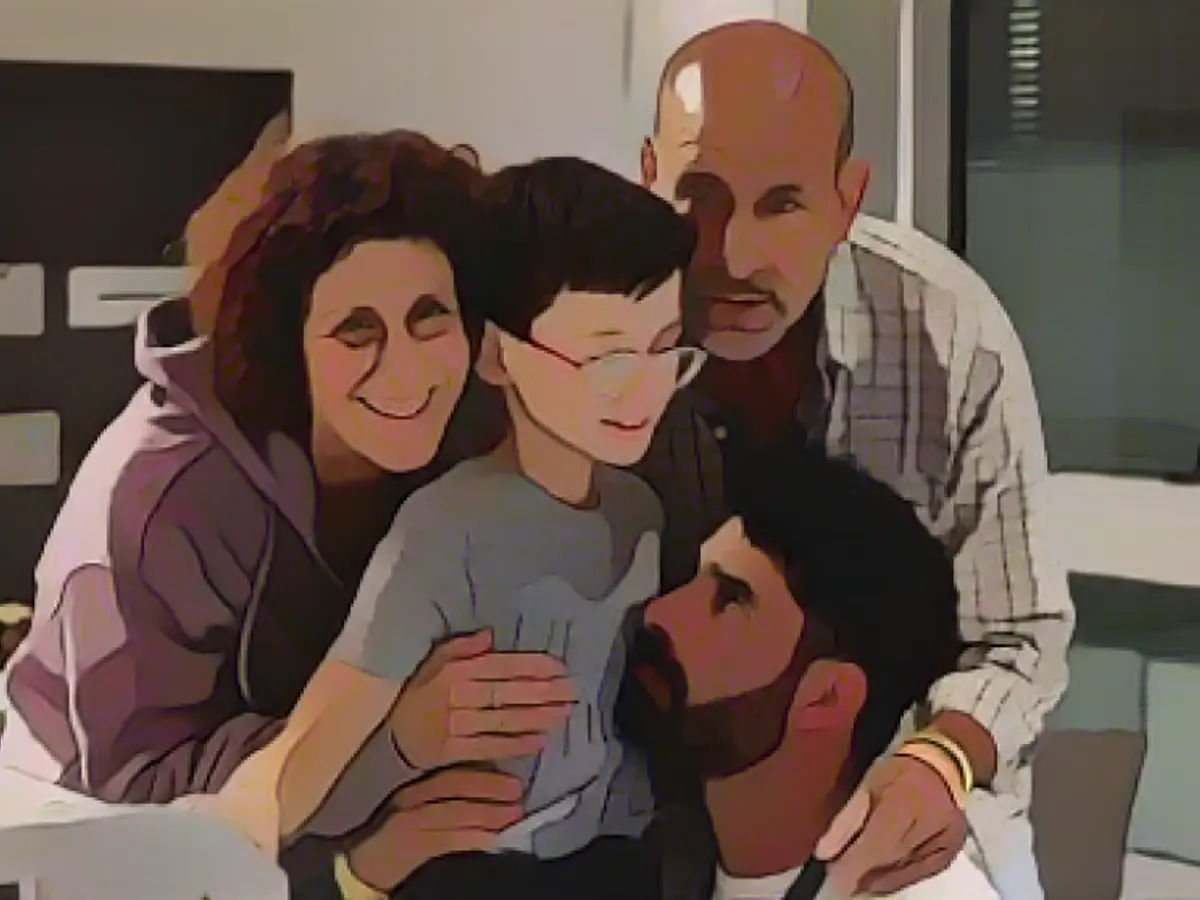 Reunited: Ohad and his family in an Israeli hospital. He had his ninth birthday in Hamas captivity Overcoming Adversity: A healthy Ohad thanks his family in the Israeli hospital