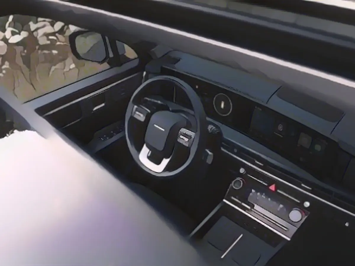 The touchscreen for operating the automatic climate control sits beneath the elegantly curved giant display.