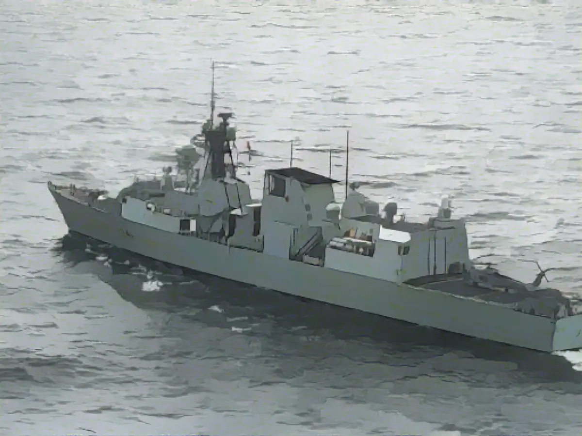 The Canadian frigate HMCS Ottawa and the US Navy Brisbane sail in formation alongside commercial fishing vessels in the East China Sea, October 26, 2023 HMCS Ottawa and US Navy Brisbane in formation, surrounded by commercial fishing vessels, October 26, 2023