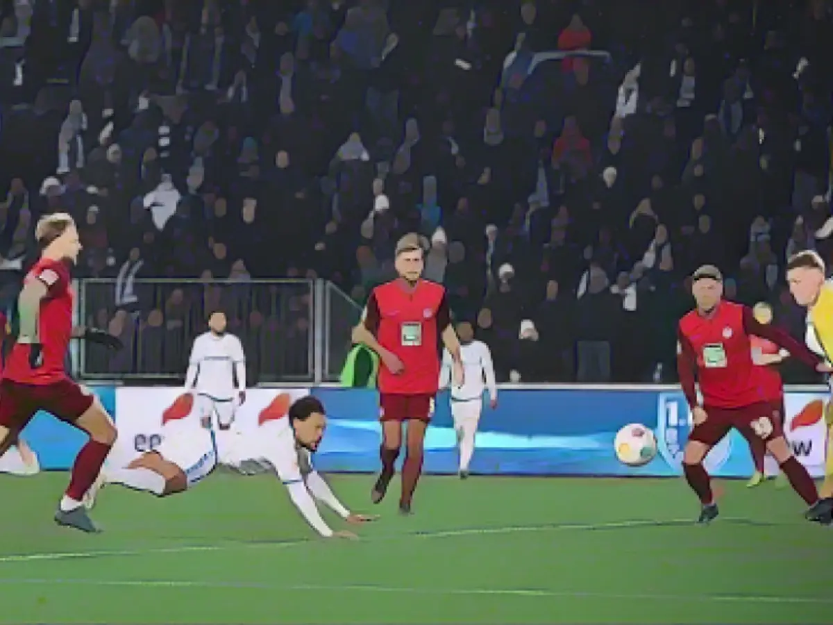 A striking image: Herbert Bockhorn (lying down) scores a header for 1 FC Magdeburg against Kaiserslautern