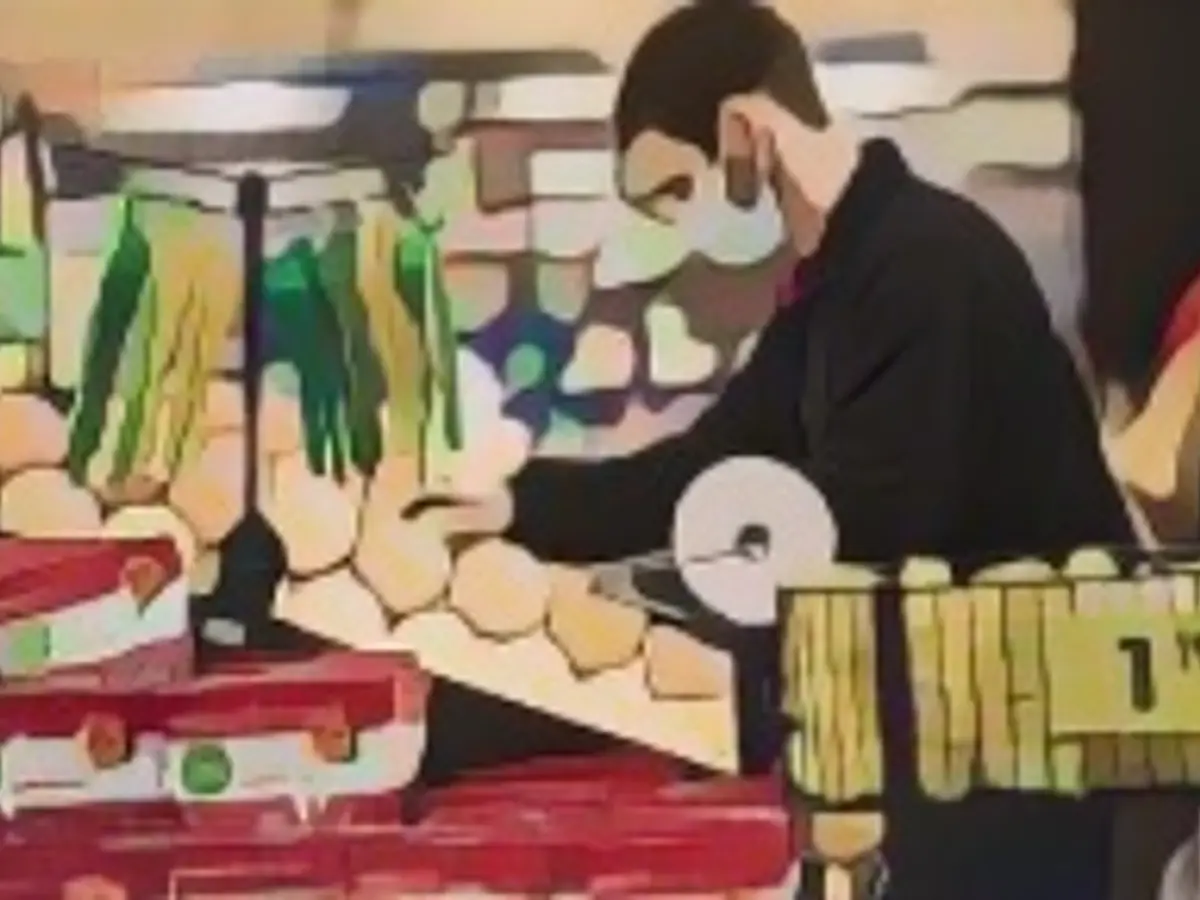 A Kroger employee restocks produce at a Kroger marketplace in Versailles, Kentucky, USA, on Tuesday, November 24, 2020 A Kroger employee restocks produce at a Kroger marketplace in Versailles, Kentucky, USA, on Tuesday, November 24, 2020.