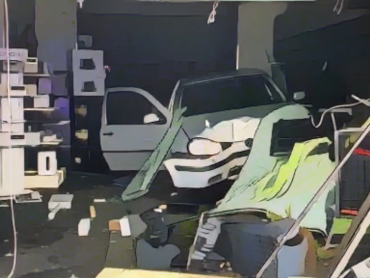 The demolished VW Golf now reigns supreme in the middle of the store. The landscape is dotted with debris