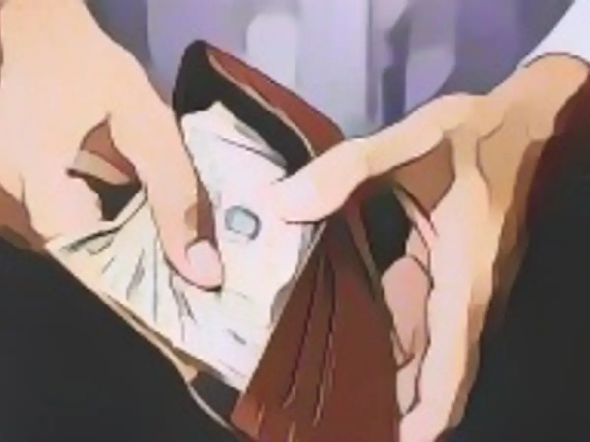 A wallet full of credit cards and bills