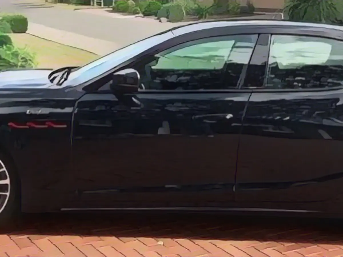The Maserati, decorated with the iconic trident symbol, was tucked away in a public parking lot, seemingly abandoned by its mysterious owner The Maserati, decorated with the iconic trident symbol, was tucked away in a public parking lot, seemingly abandoned by its mysterious owner