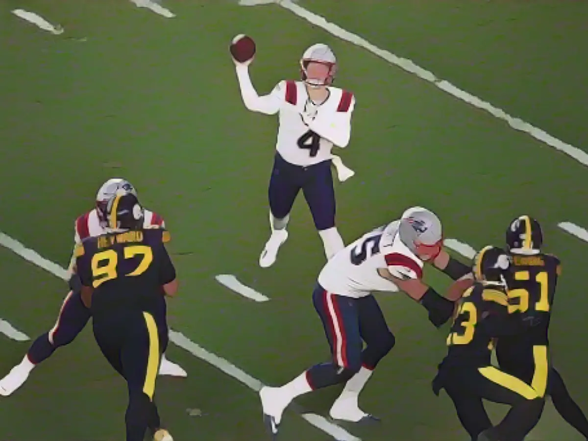 Zappe threw a pass as the Steelers defended in the second half of the game.