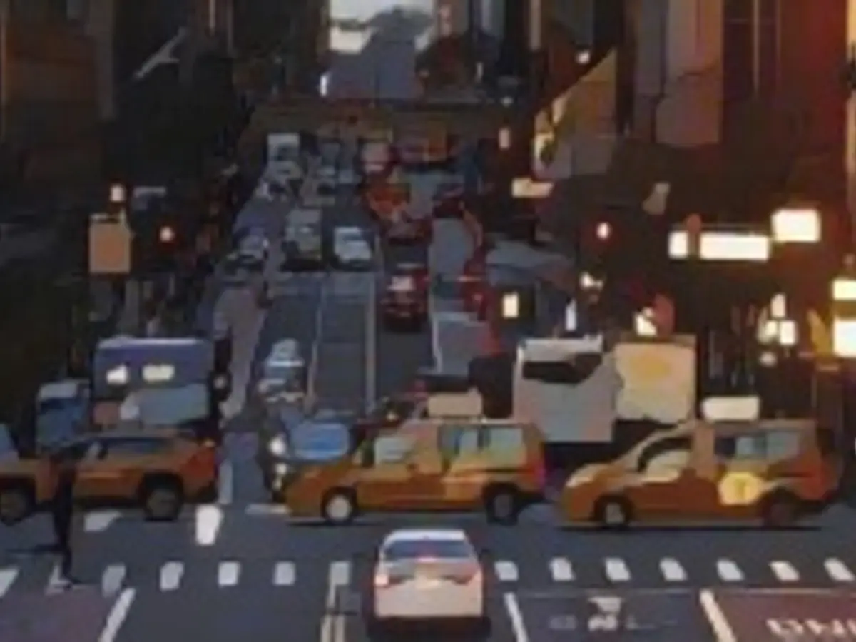 Такси пересекают 42-ю улицу во время восхода солнца 8 декабря 2022 года в Нью-Йорке.