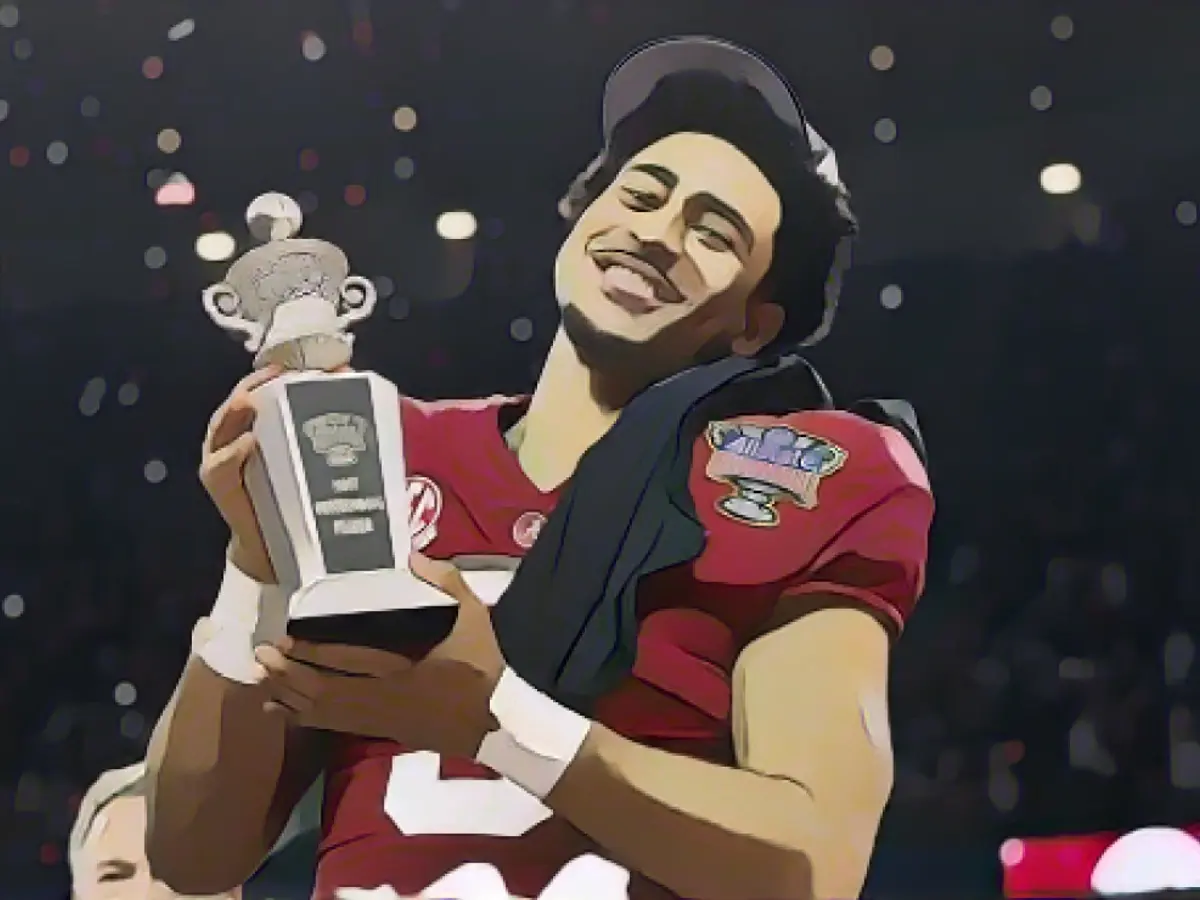 Young celebrates after Alabama's Sugar Bowl victory over Kansas State, clutching the 'Most Outstanding Player' trophy in hand. Young celebrates after Alabama's Sugar Bowl victory over Kansas State, clutching the "Most Outstanding Player" trophy in hand.