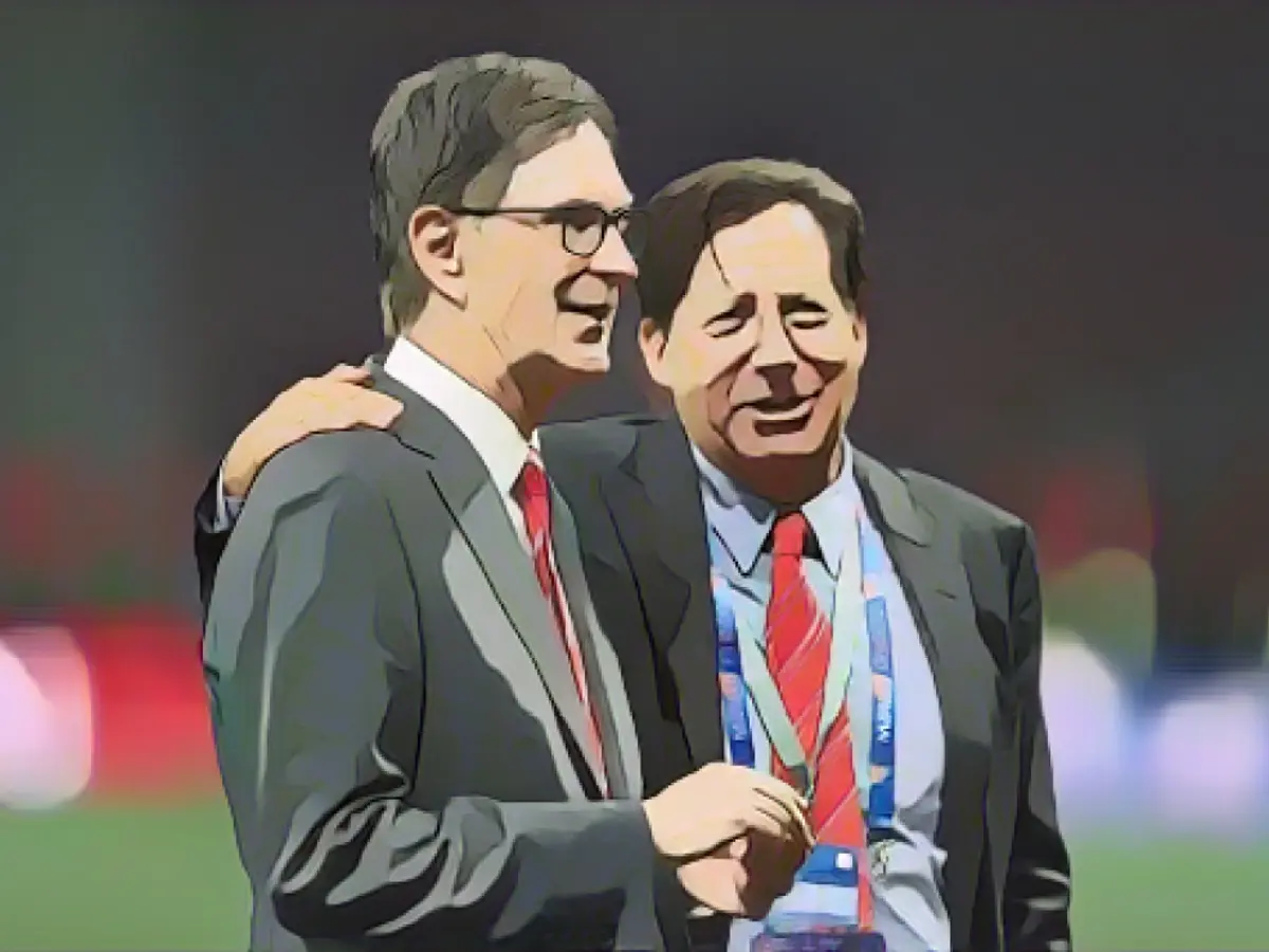 O proprietário do Liverpool, John W. Henry (à esquerda), e o presidente Tom Werner após a final da Liga dos Campeões da UEFA no Wanda Metropolitano, em Madrid.