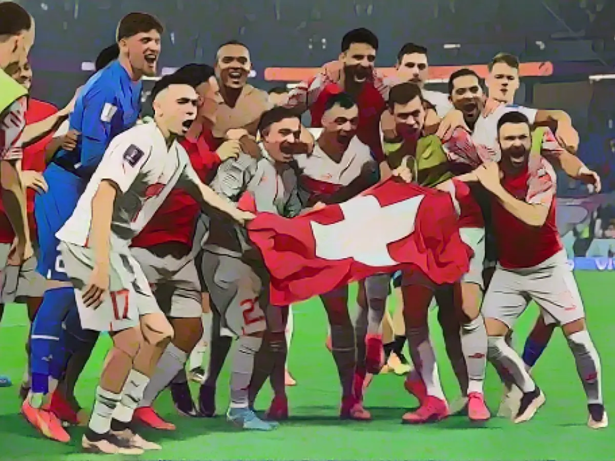 Швейцария празднует победу над Сербией со счетом 3:2 и выход в нокаут.