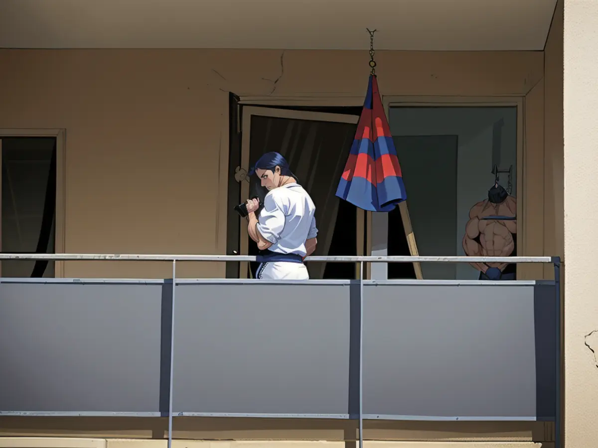 A forensics investigator takes photos on the balcony of the man who held the three-year-old captive