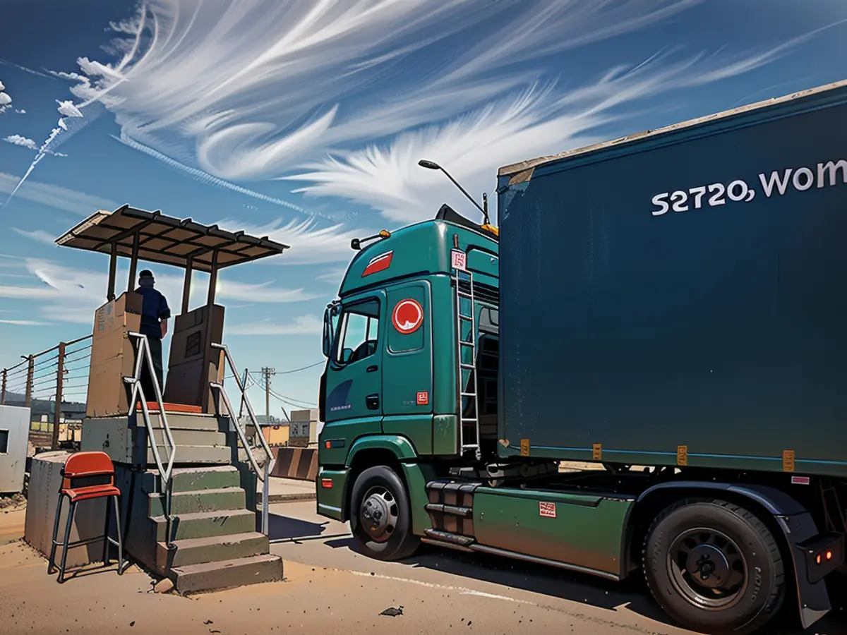 A truck carrying humanitarian aid for the Gaza Strip passes through the Kerem Shalom Crossing in southern Israel last March.