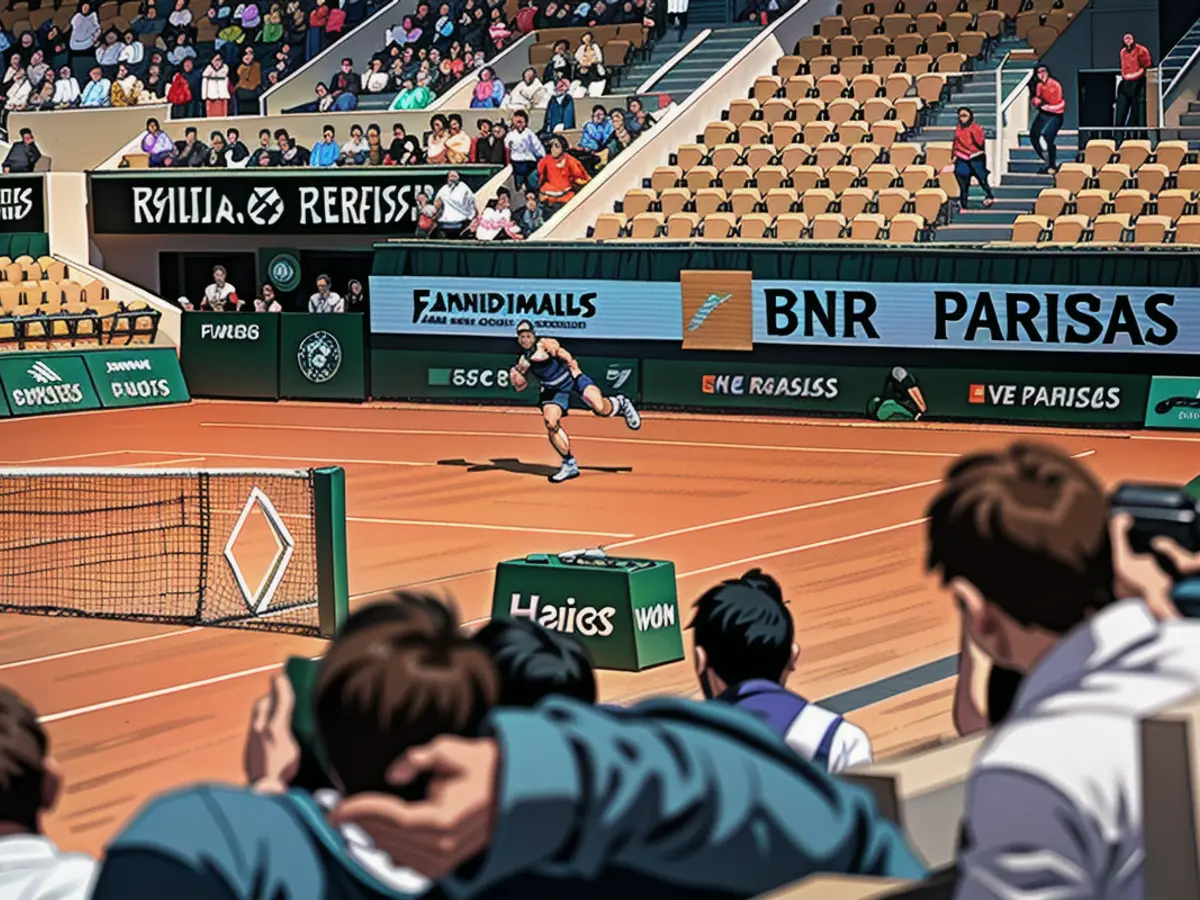 Rafael Nadal practices at Roland Garros in Paris with logos flanking the court.