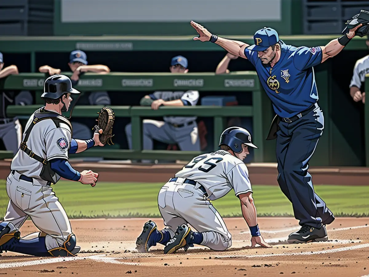 Hernández calls Adam Frazier of the Pittsburgh Pirates safe after a play at the plate during a game against the Milwaukee Brewers.