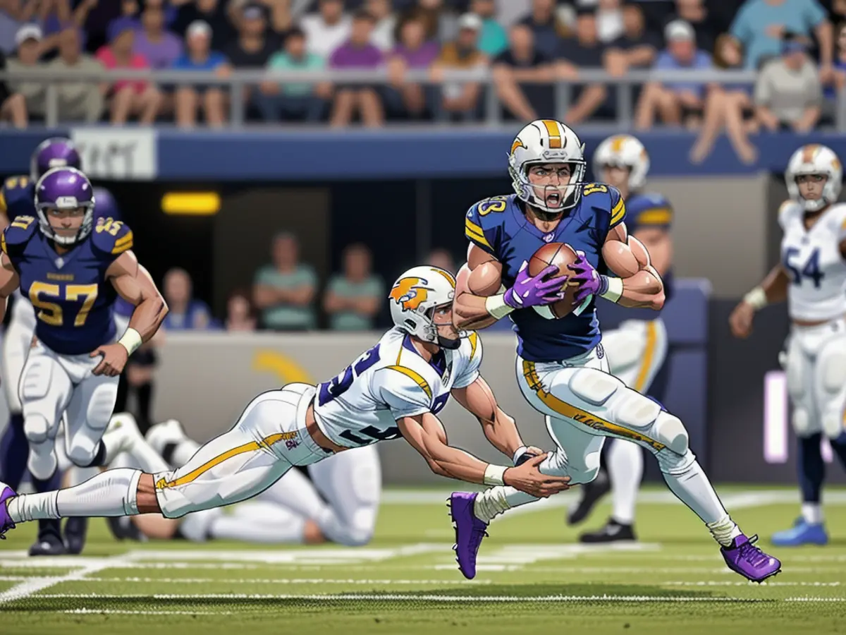 Jefferson runs past JT Woods of the Los Angeles Chargers while scoring a touchdown during a game last season.