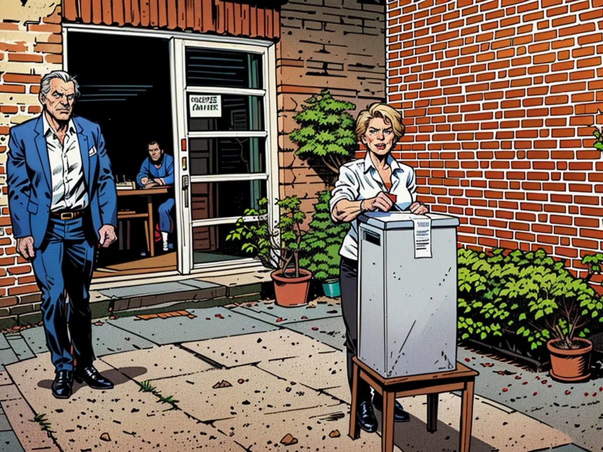 Ursula von der Leyen casts her ballot in a ballot box next to her husband Heiko.