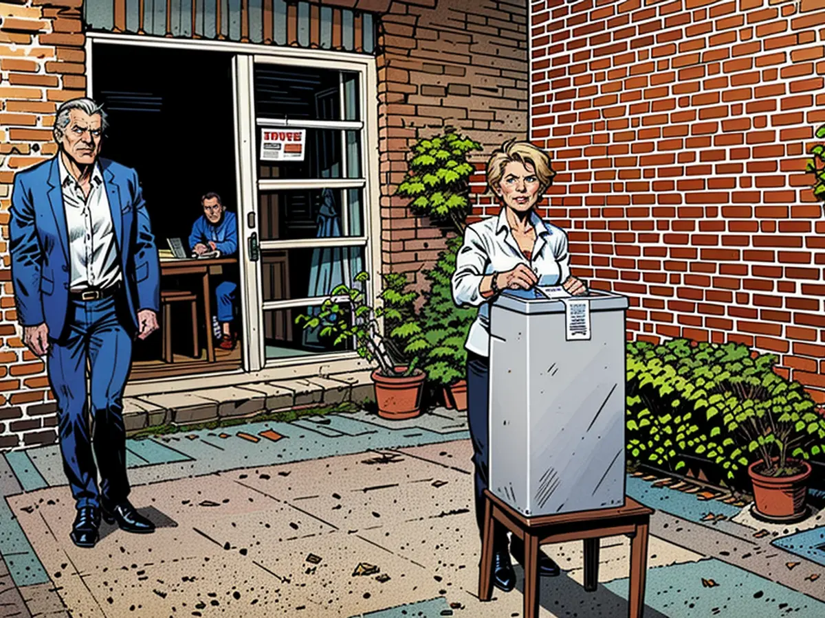 Ursula von der Leyen casts her ballot in a ballot box next to her husband Heiko.