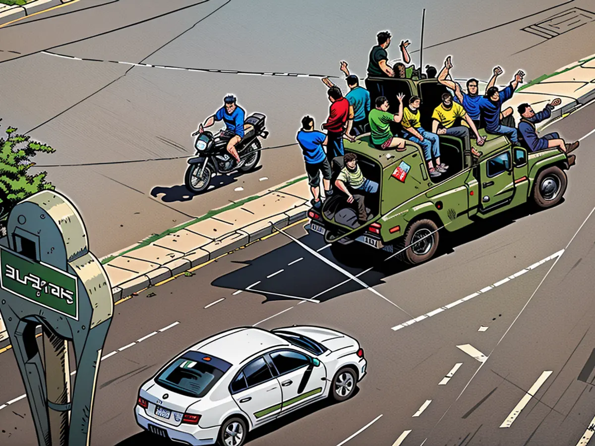 Palestinian militants drive a captured Israeli military vehicle in Gaza City on October 7, 2023, after the attacks on Israel.