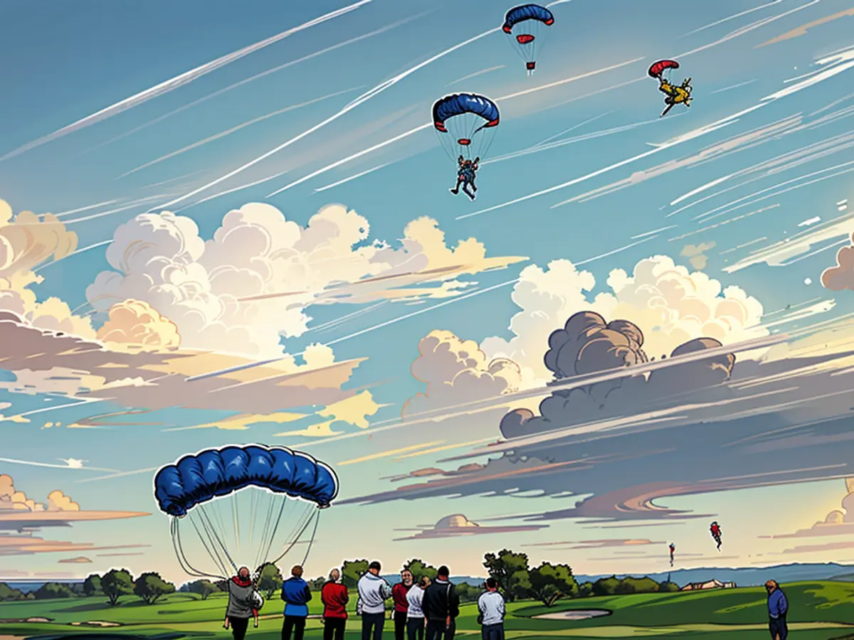 Varios paracaidistas aterrizan en el campo de golf.
