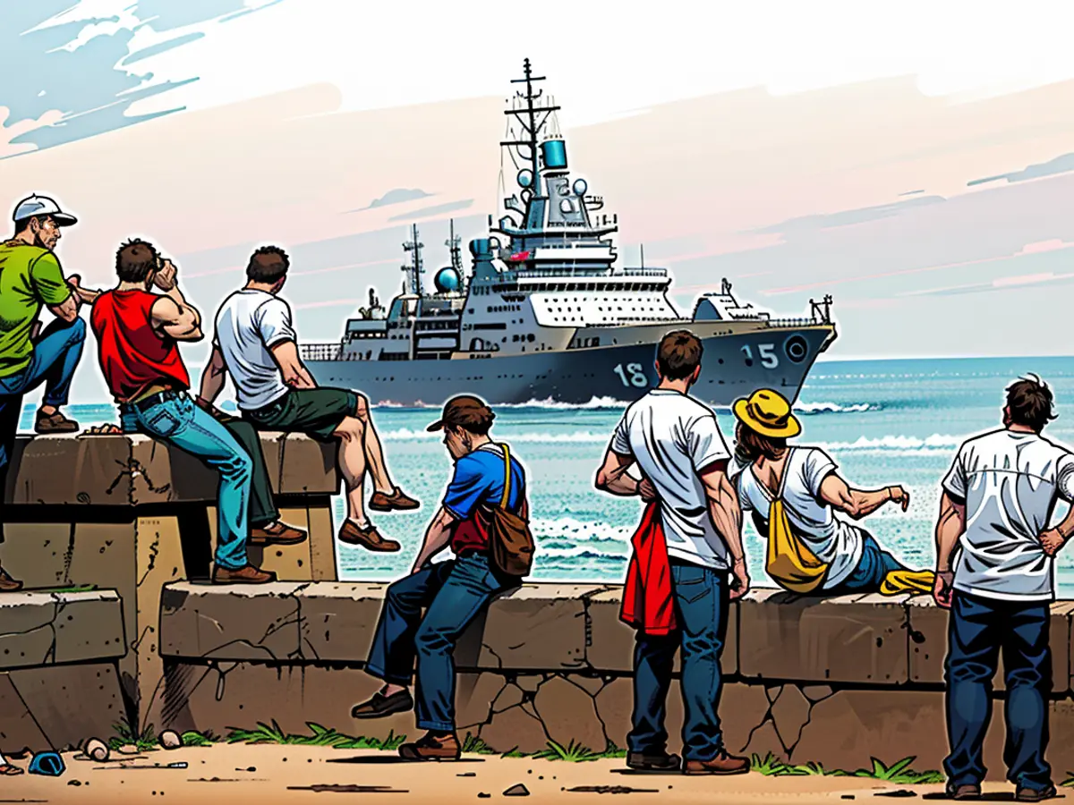 People watch a ship belonging to the Russian Navy flotilla arrive at the port of Havana on Wednesday, June 12, 2024, in Havana, Cuba.