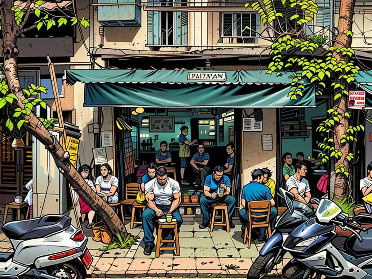 Clientes sentados en una cafetería de Hanoi, Vietnam.