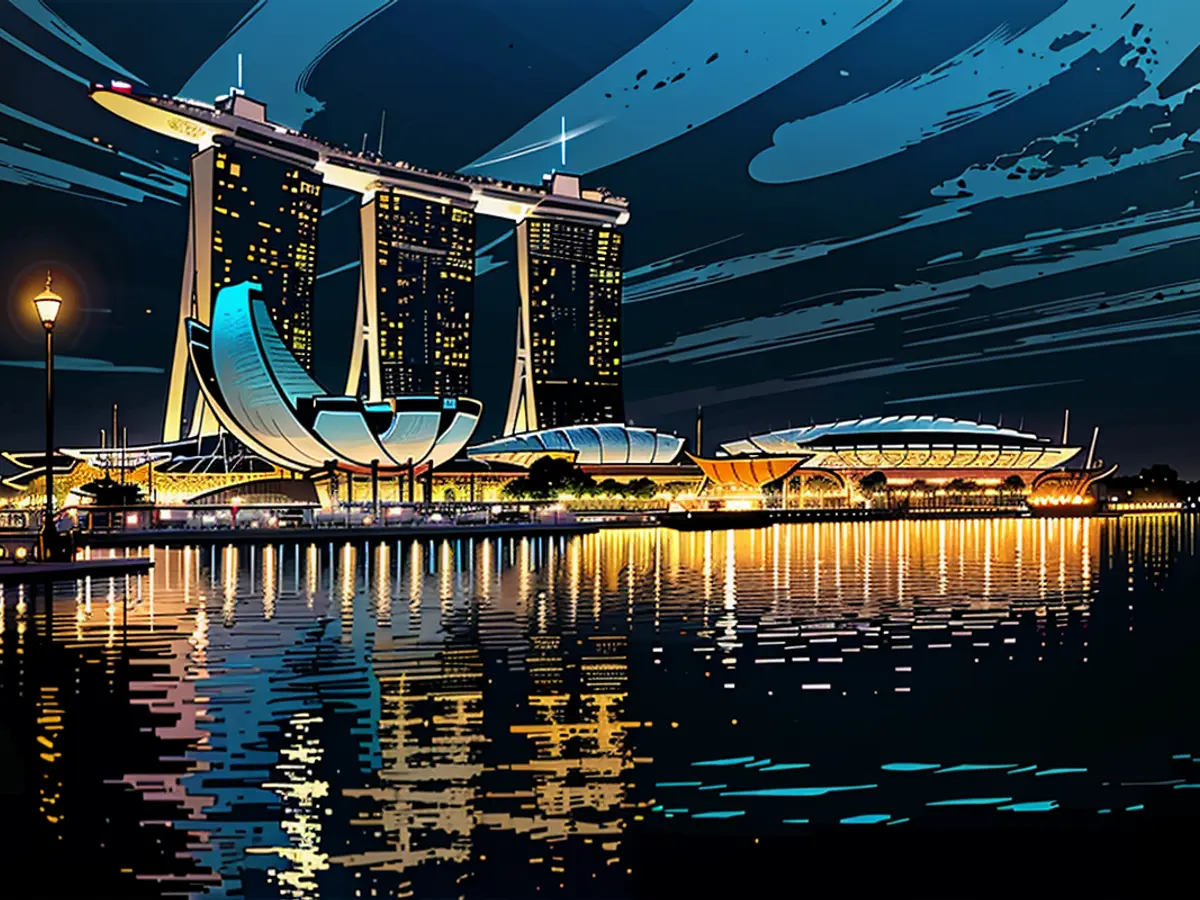 Le casino Marina Bay Sands à Singapour, de nuit. Une résidente locale a volé l'argent d'un temple...