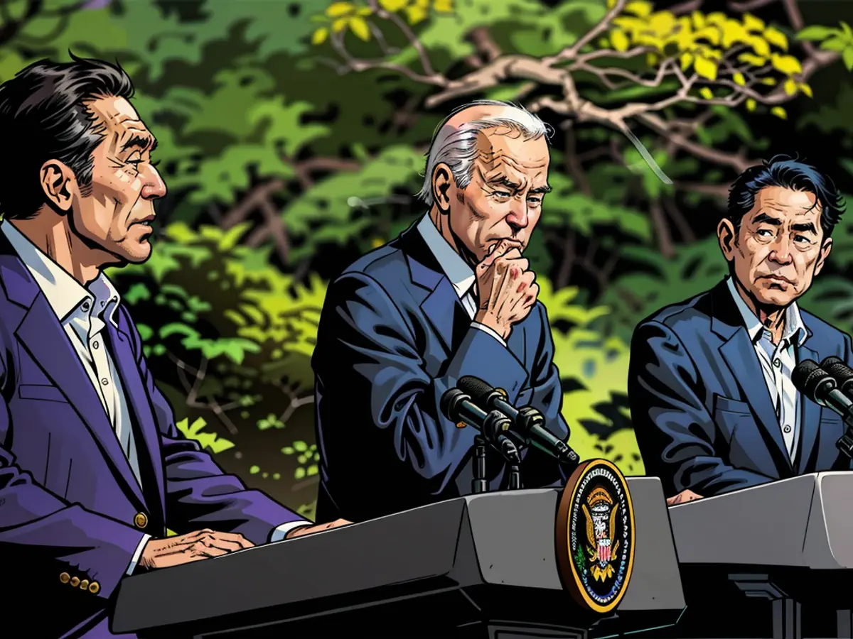 President Joe Biden and Japan's Prime Minister Fumio Kishida (right), listen as South Korea's President Yoon Suk Yeol speaks during a news conference at Camp David on August 18, 2023.