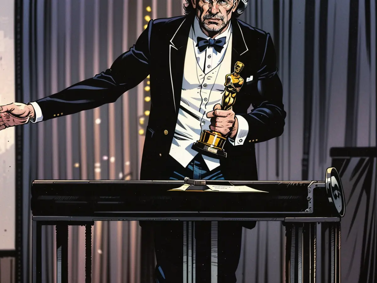 David Puttnam raccoglie l'Oscar per Miglior Film nel 1982.