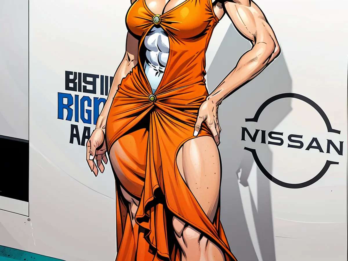 Ice Spice has become known for her bright orange hair, color matched here with a vintage Versace dress at the 2024 BET Awards on June 30, 2024 in LA.