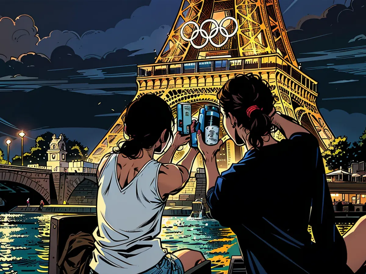 Das Eiffelturm ist am 21. Juli 2024 in Paris, Frankreich, mit den Olympischen Ringen geschmückt. Die Stadt bereitet sich darauf vor, die XXXIII. Sommerspiele von dem 26. Juli bis 11. August auszurichten.