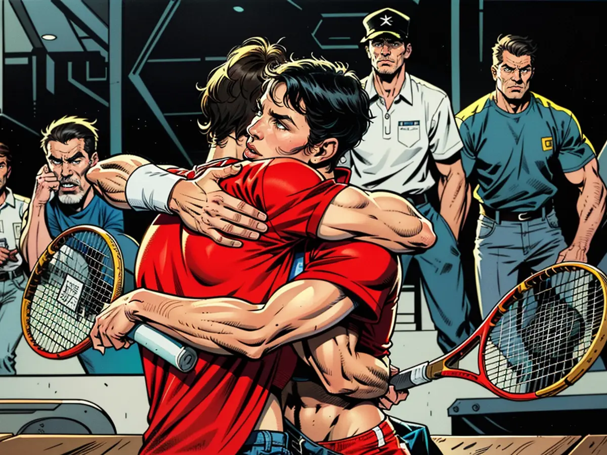 Nadal, left, and partner Alcaraz embrace during the match.