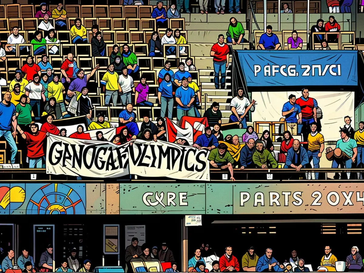 Fans halten ein Banner, auf dem 'Genozid-Olympiade' steht, während des Israel-Paraguay-Spiels.