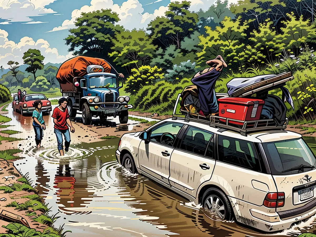 Displaced people fleeing fighting in Lashio try to cross the flooded road to Taunggyi in Myanmar's northern Shan state on July 9, 2024.