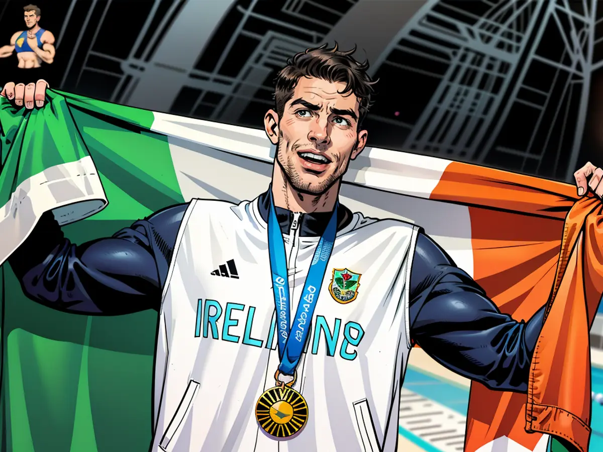 Paris 2024 Olympics - Swimming - Men's 800m Freestyle Victory Ceremony - Paris La Defense Arena, Nanterre, France - July 30, 2024. Gold medallist Daniel Wiffen of Ireland celebrates after winning and setting a new Olympic record. REUTERS/Ueslei Marcelino