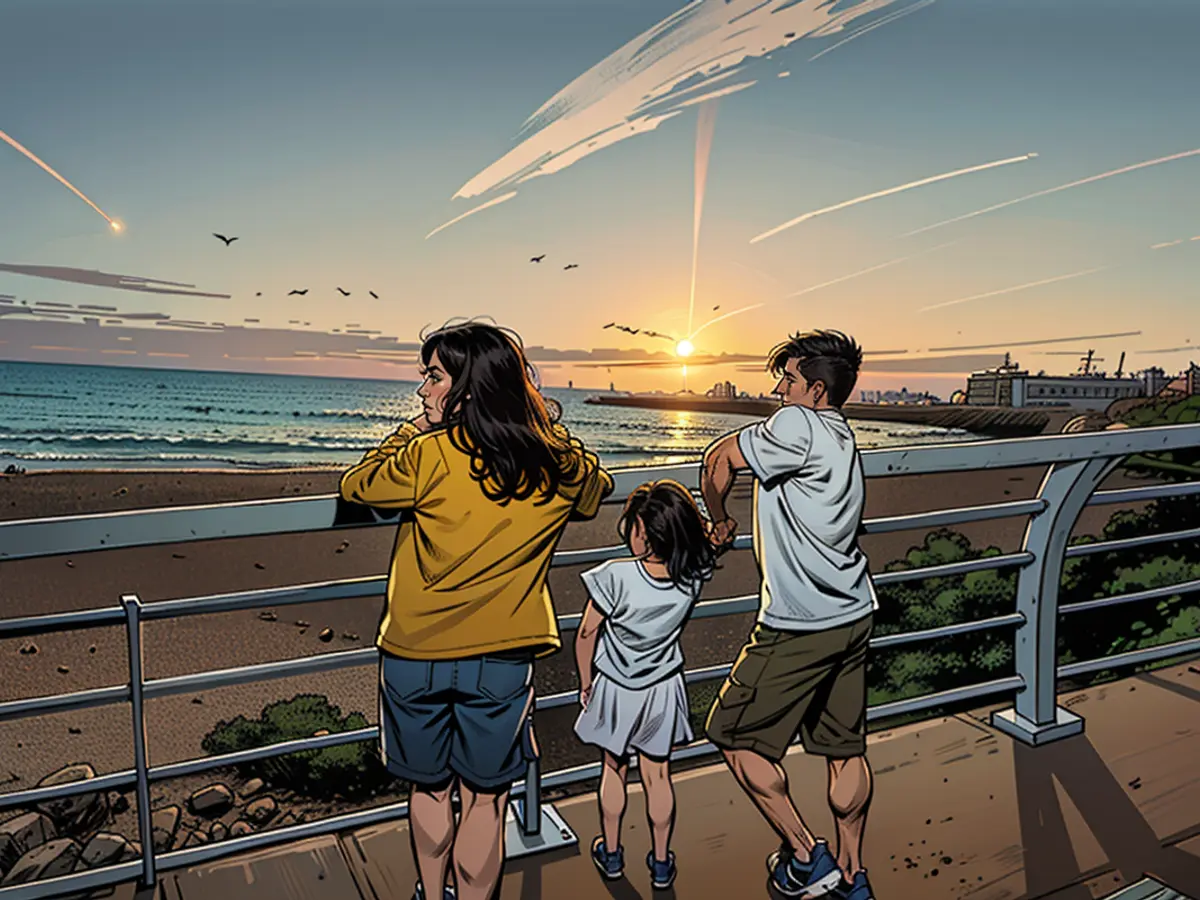 Kayta and her cousins, age 9 and 11, watch the sunset in Beirut on Tuesday, July 30. Moments later, the Israeli military carried out a “targeted strike” in southern Beirut, roughly 10 minutes’ drive away.