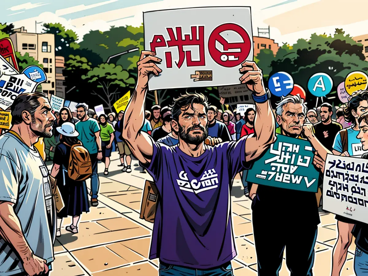 Michael Ofer Ziv trägt ein Schild mit der Aufschrift 'Frieden' auf Arabisch und Hebräisch, auf dem er eine Waffenruhe und einen Geisel.math.detail; ND in Tel Aviv fordert.