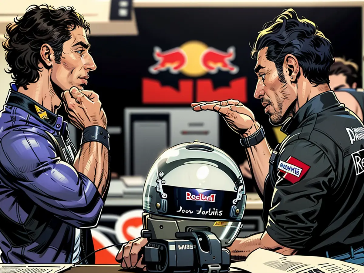 IN JEREZ DE LA FRONTERA, SPAIN, ON DECEMBER 2 - Daniel Ricciardo from Australia, representing Red Bull, engages in a discussion with physiotherapist Roger Cleary, as he prepares for his drive at the Circuito De Jerez in the year 2009.