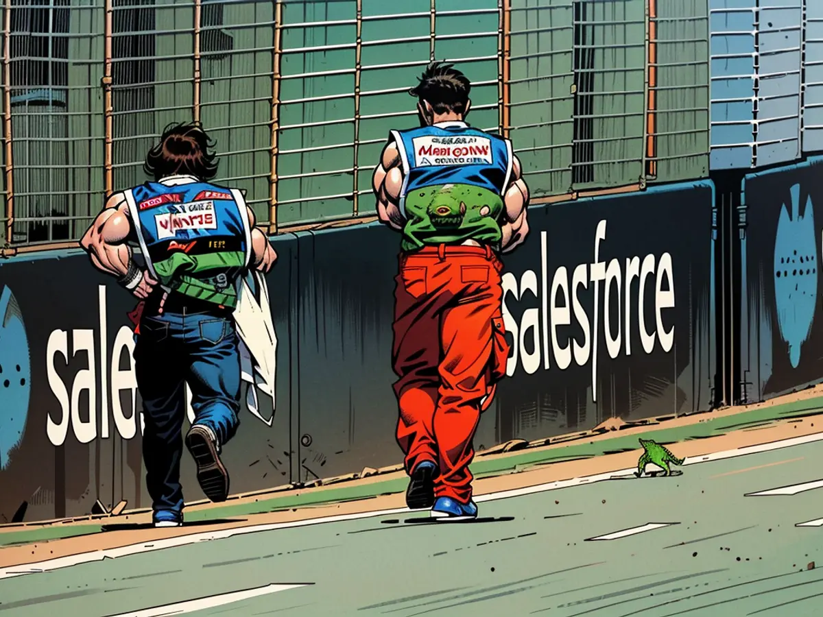 Law enforcement officials chase a reptile off the racetrack during preliminary exercises before the Singapore Grand Prix.