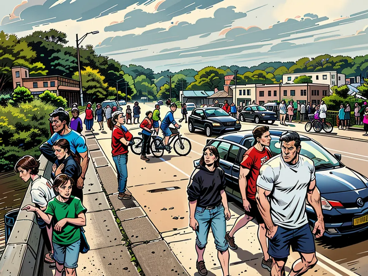 City dwellers in Asheville assess the wreckage in the River Arts District following intense downpours and flooding brought about by Hurricane Helene's leftovers, on September 28.