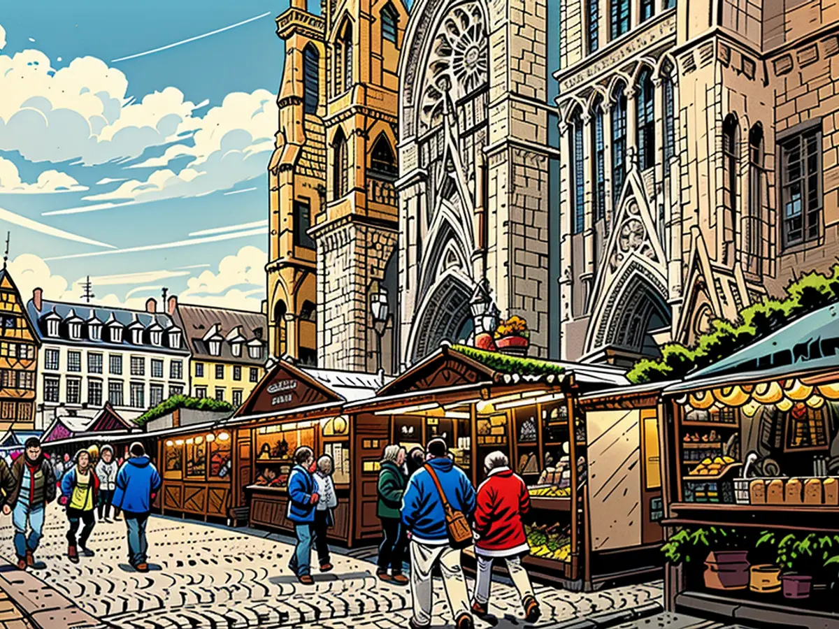 Individuals wander through the market stalls situated at Place de la Cathédrale in Strasbourg, France. This year, the market commences its operation on November 27.